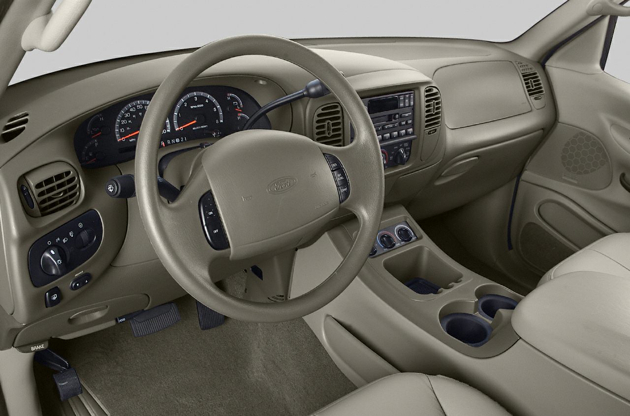 Dashboard and steering wheel interior view with center console and controls.