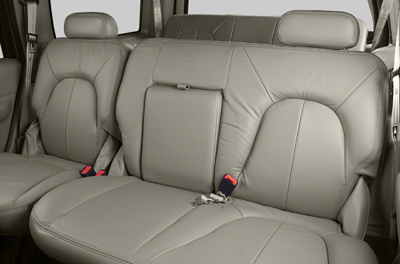Leather rear bench seat with headrests and seat belts.