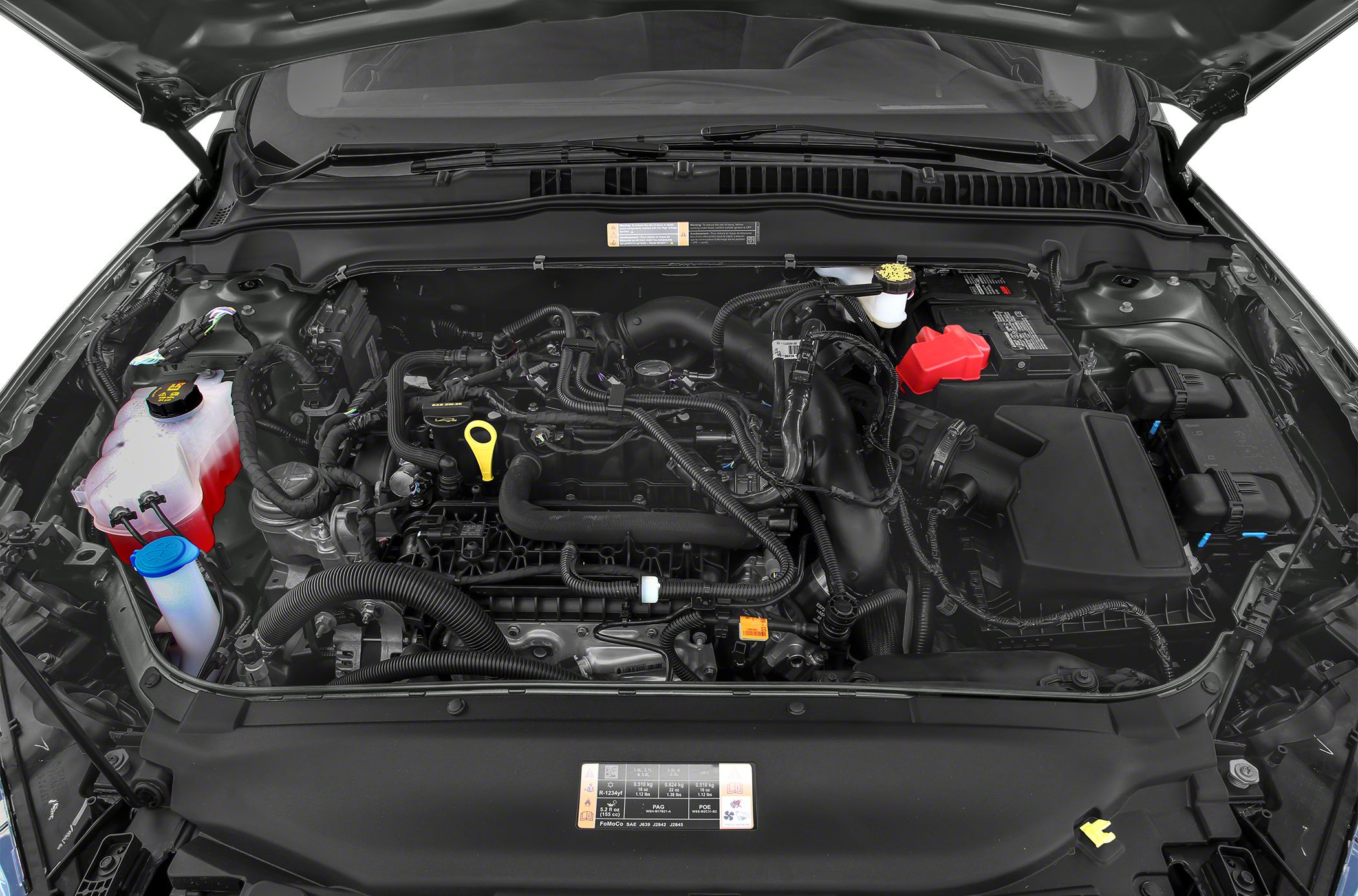 Engine bay view showing engine components and hoses.