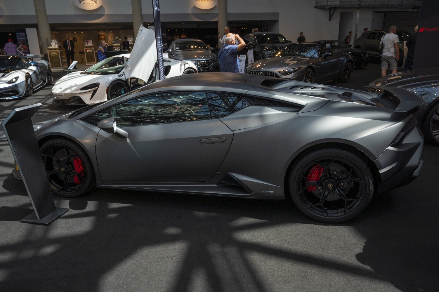 Side profile showing sharp lines and aerodynamic features of a modern supercar.