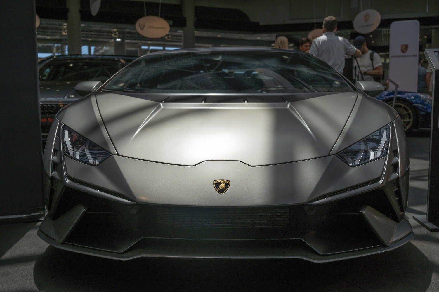 Aggressive headlights and aerodynamic front design of a high-performance sports car