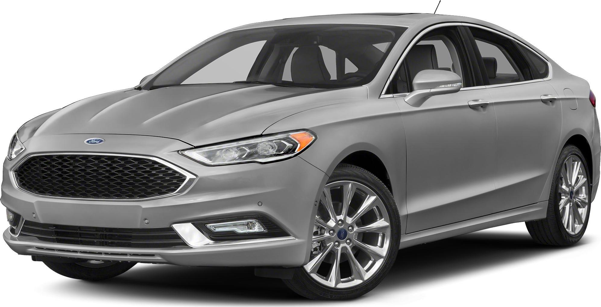 Front side view of a silver sedan with sleek grille and alloy wheels.
