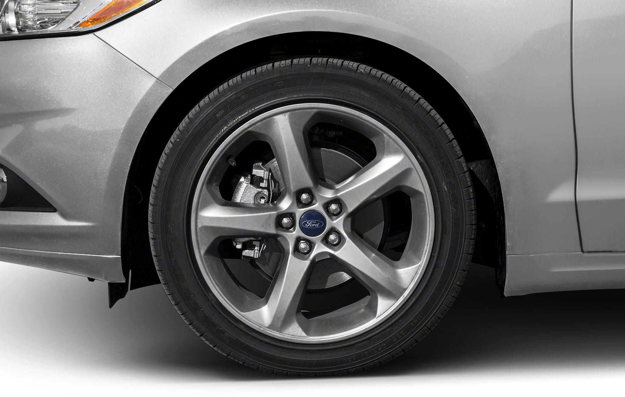 Close-up of alloy wheel and front fender with tire and brake details