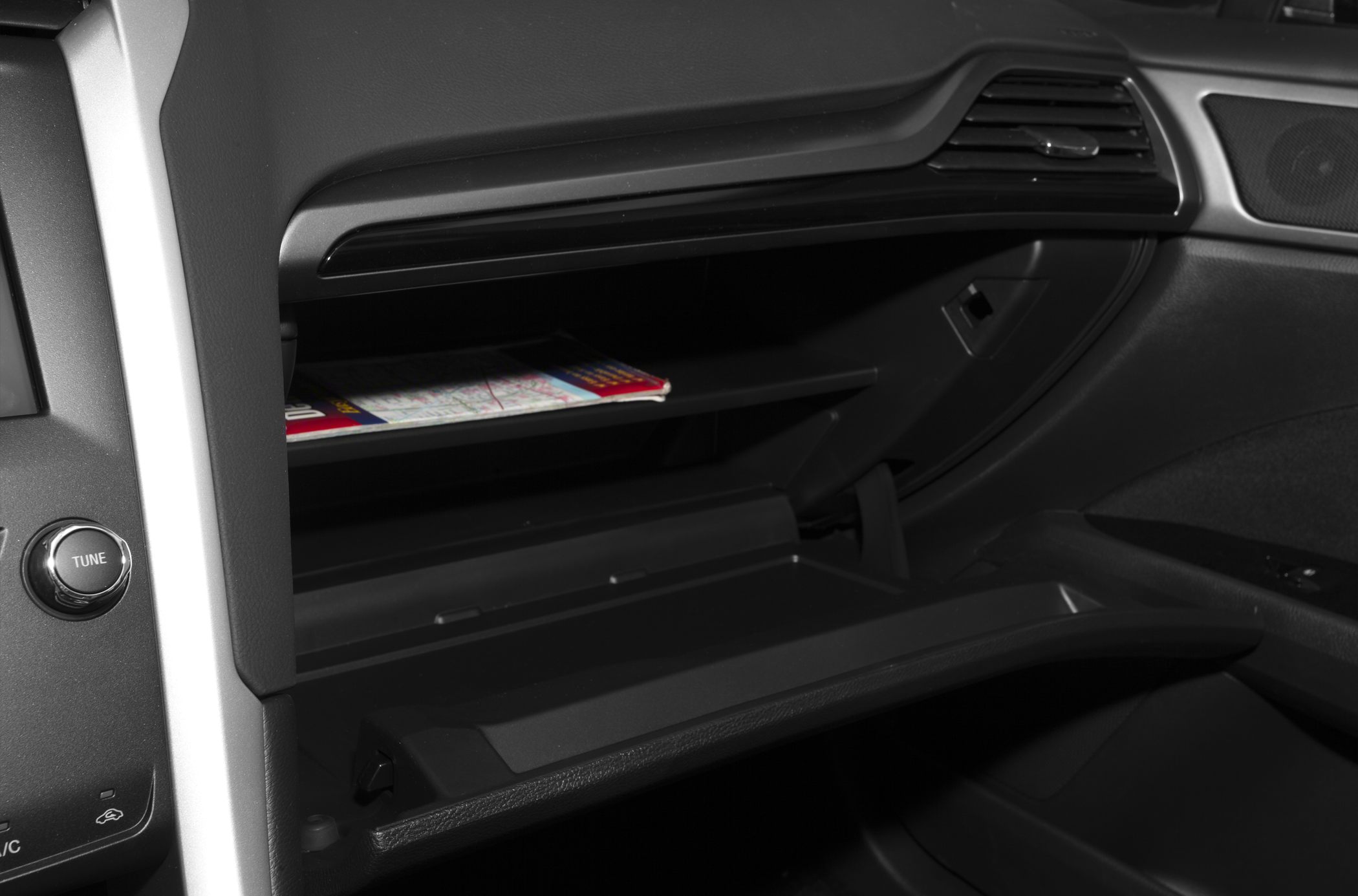 Open glove compartment with interior storage shelf