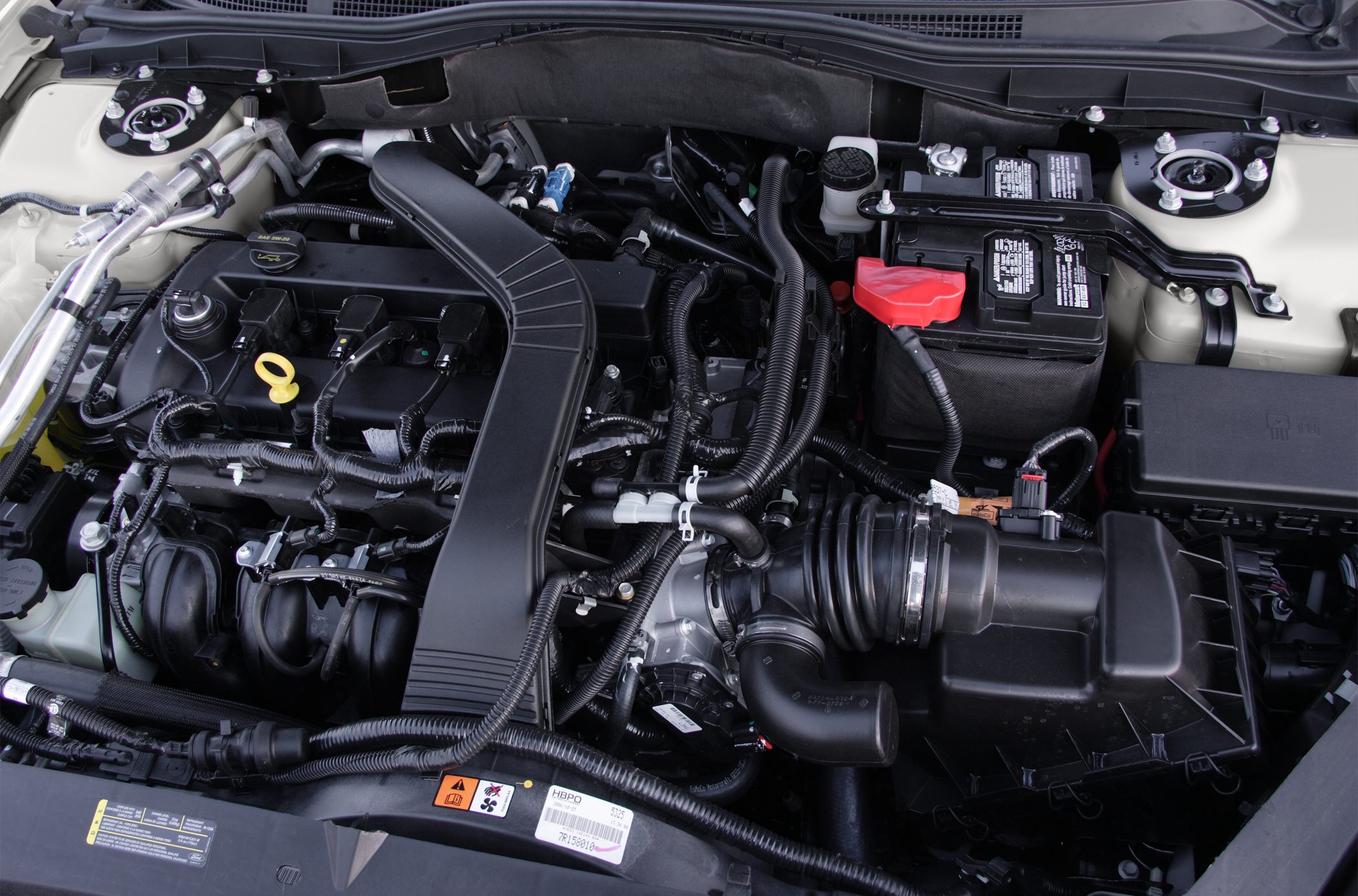 Detailed engine bay with intake, battery, and wiring harnesses
