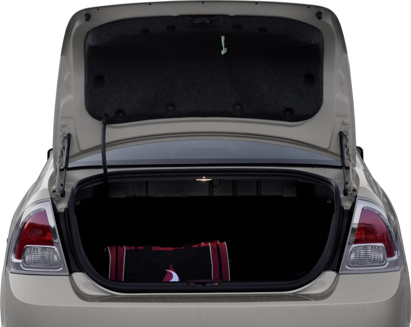 Open sedan trunk with ample cargo space and a bag