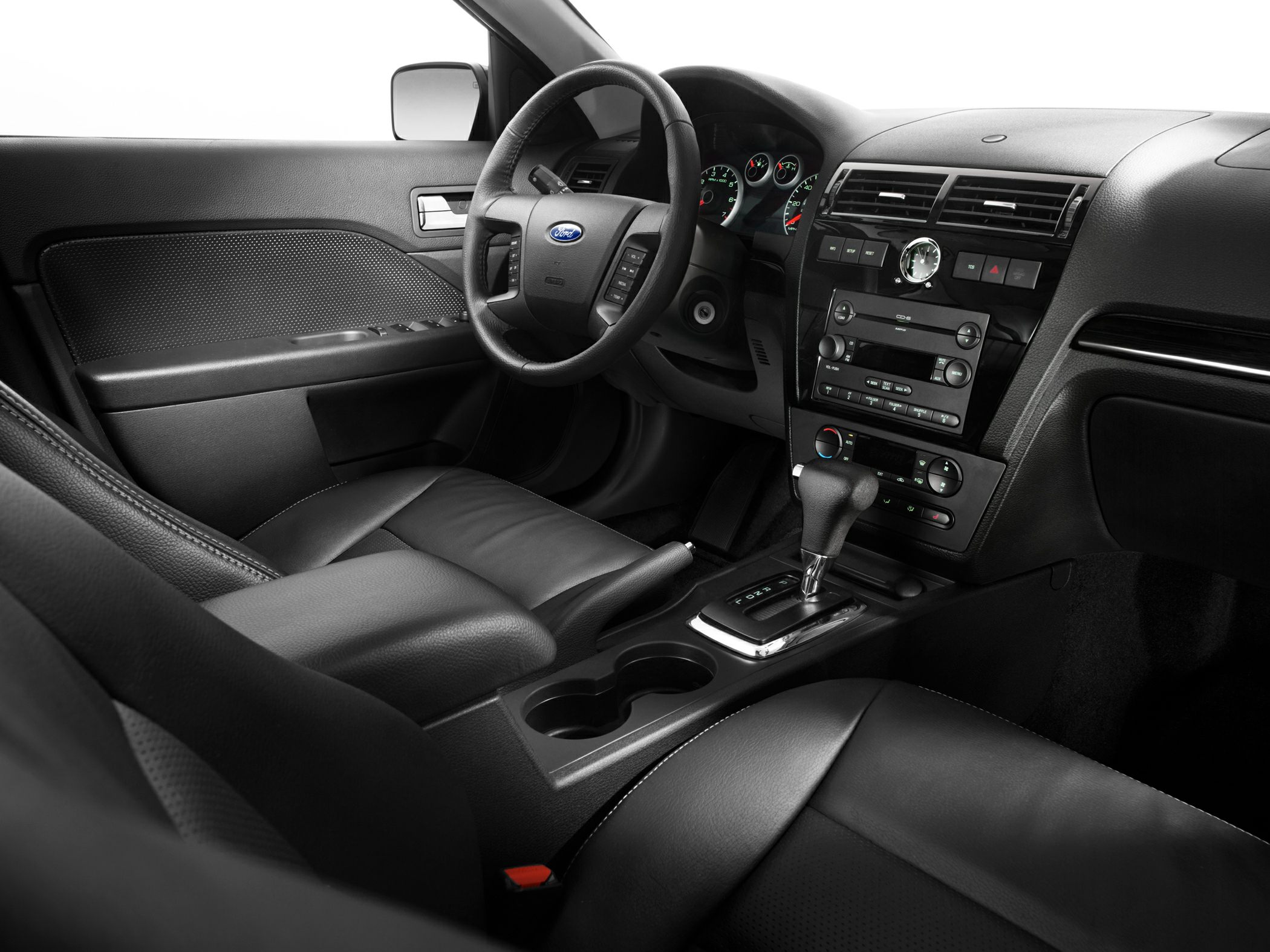 Dashboard, steering wheel, and center console with gear shifter