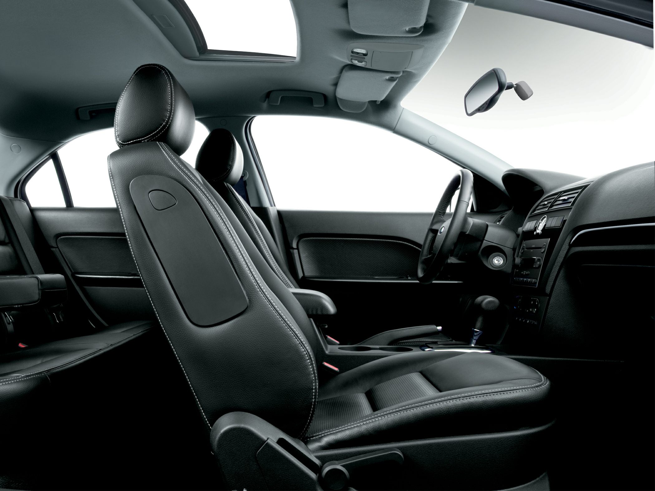 Black leather seats with white stitching and a sunroof in front cabin.