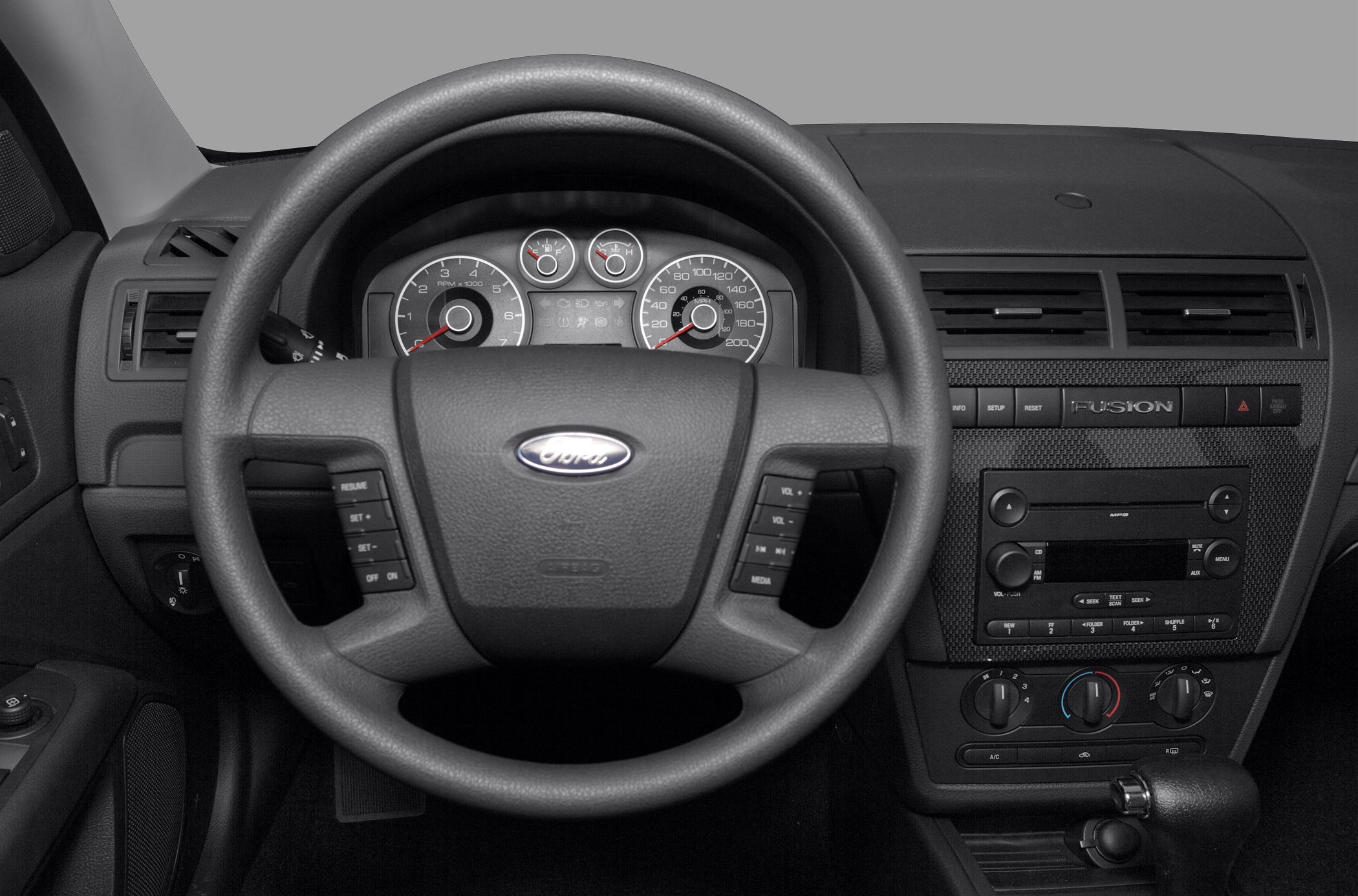 Steering wheel with control buttons and dashboard with instrument panel