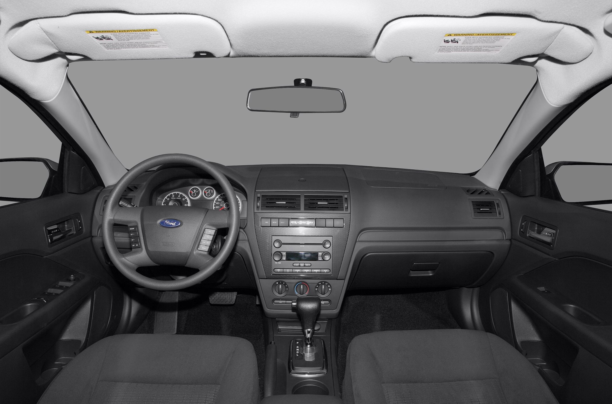 Dashboard layout with steering wheel and center console featuring gear shift