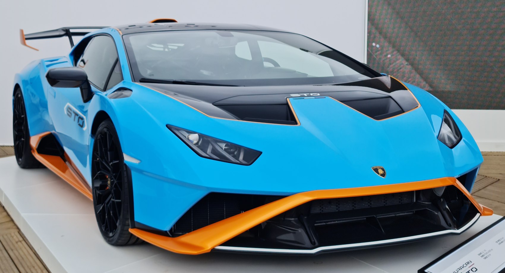 Aerodynamic front end with blue and orange accents and aggressive styling