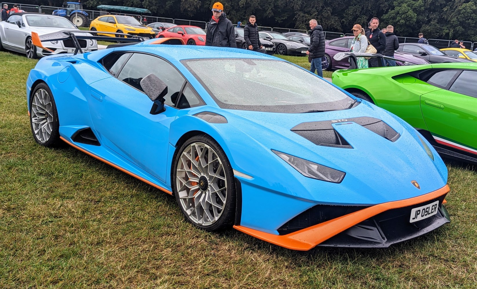 Aerodynamic vents, sharp headlights, and sporty wheels with a racing rear wing.