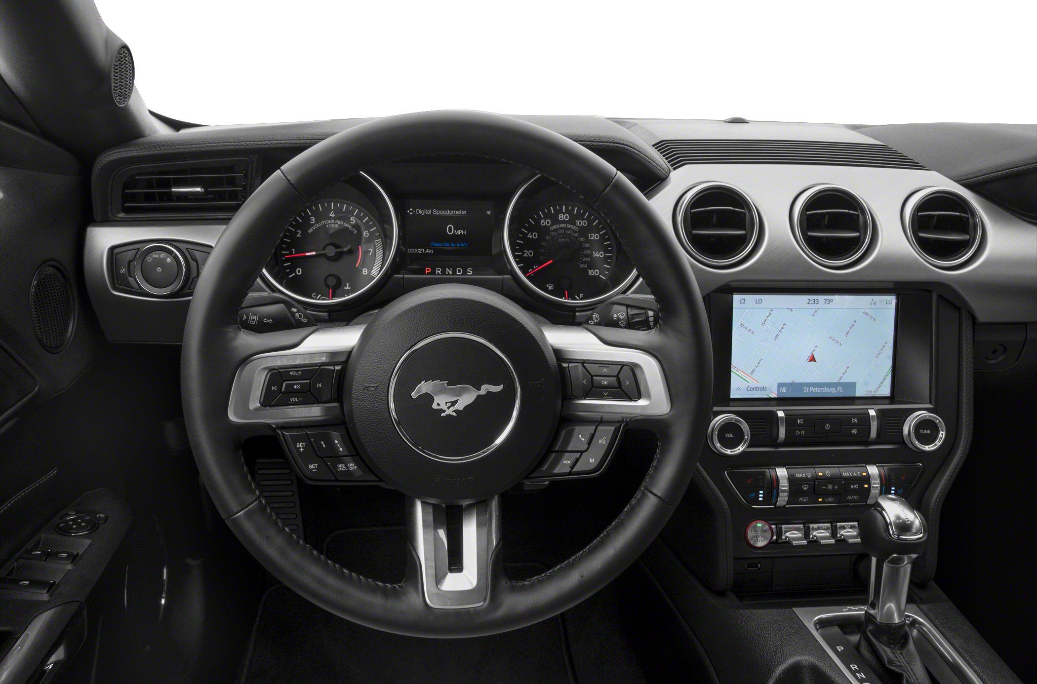 Steering wheel, digital gauges, and touchscreen controls on car dashboard