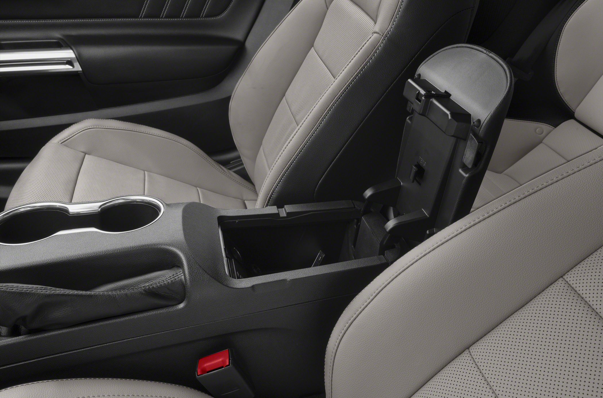Center console storage compartment and perforated leather seats
