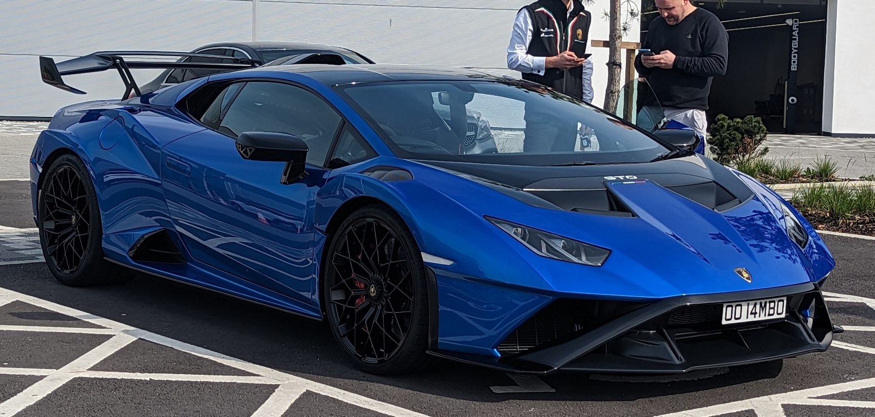 Blue Lamborghini Huracan STO with advanced aerodynamics and racing wing