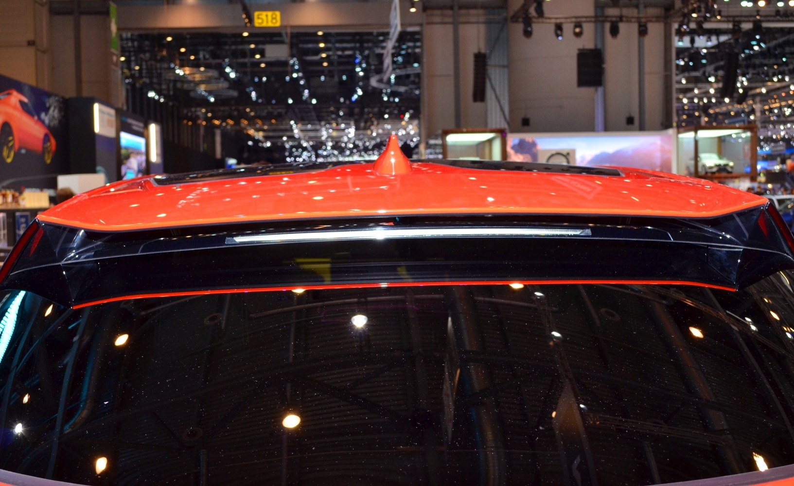 Rear roof spoiler and shark fin antenna on an electric SUV