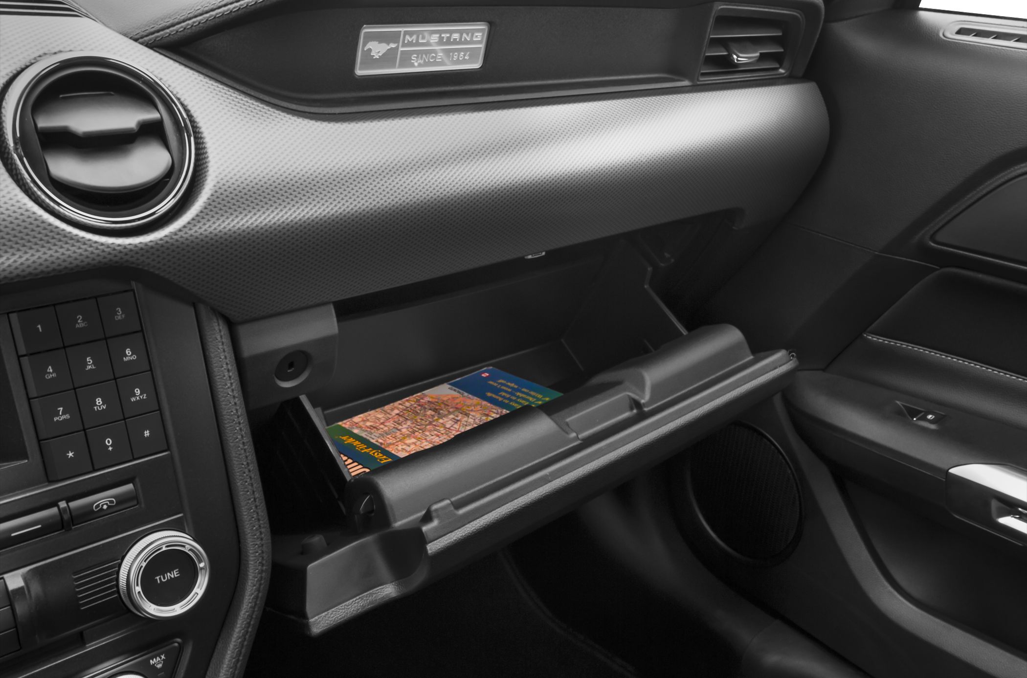 Dashboard and open glove compartment with storage and air vent