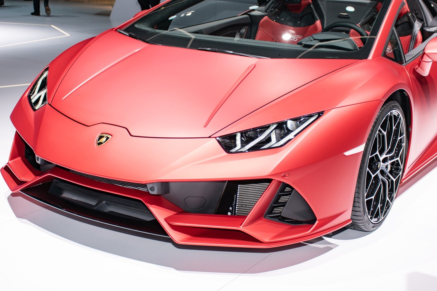 Front end close-up with sharp headlights and sporty air intakes