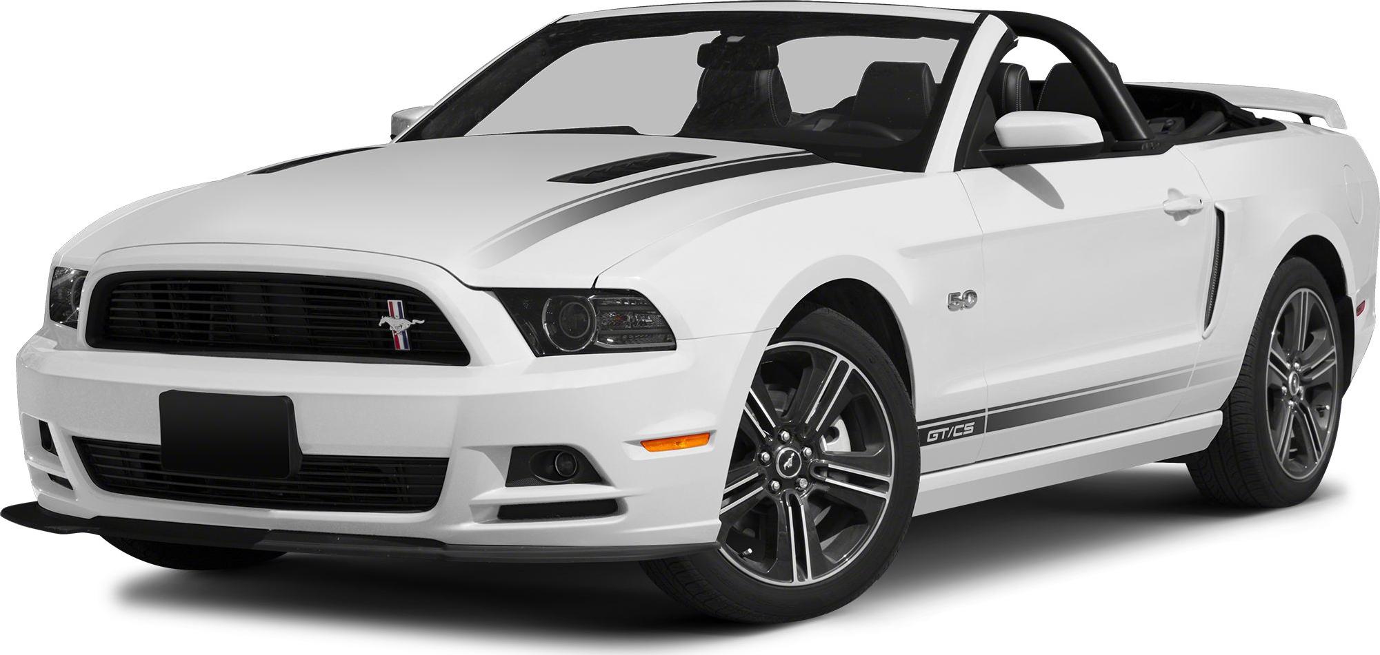 Front three-quarter view of white convertible with racing stripes and GT/CS badges