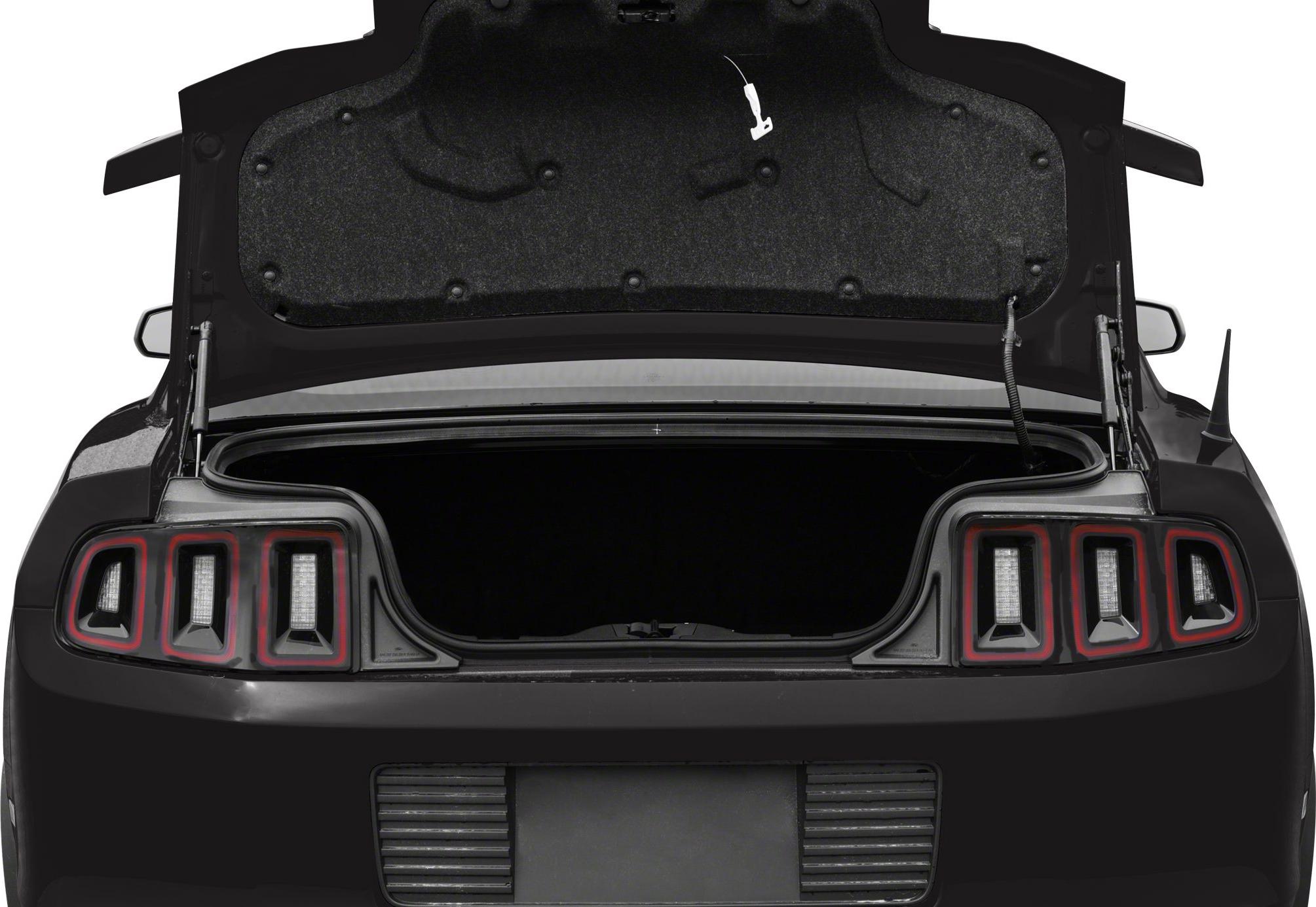 Distinctive rear tail lights and open trunk of a 2013 model