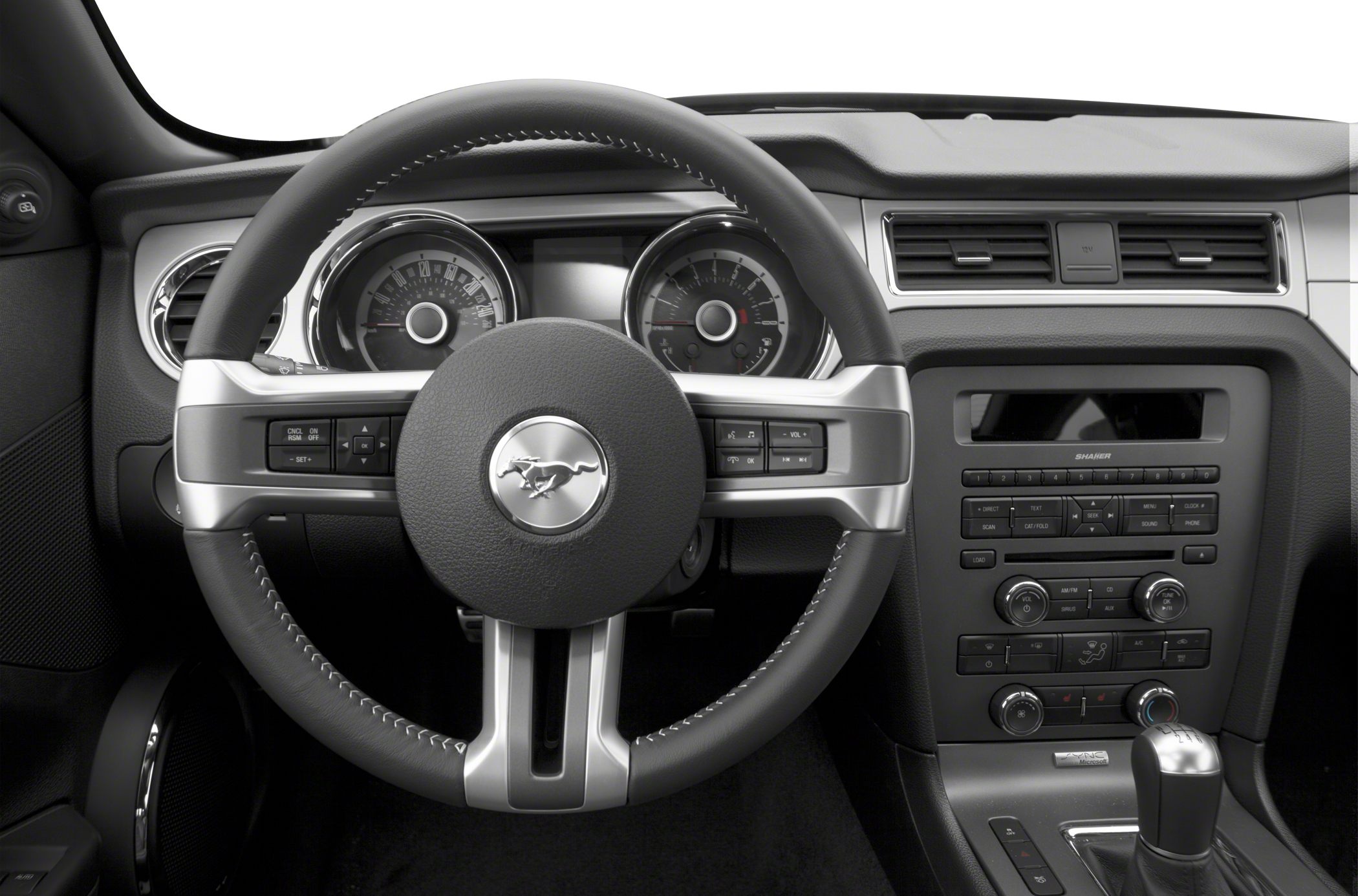Steering wheel, instrument cluster, and center console with controls