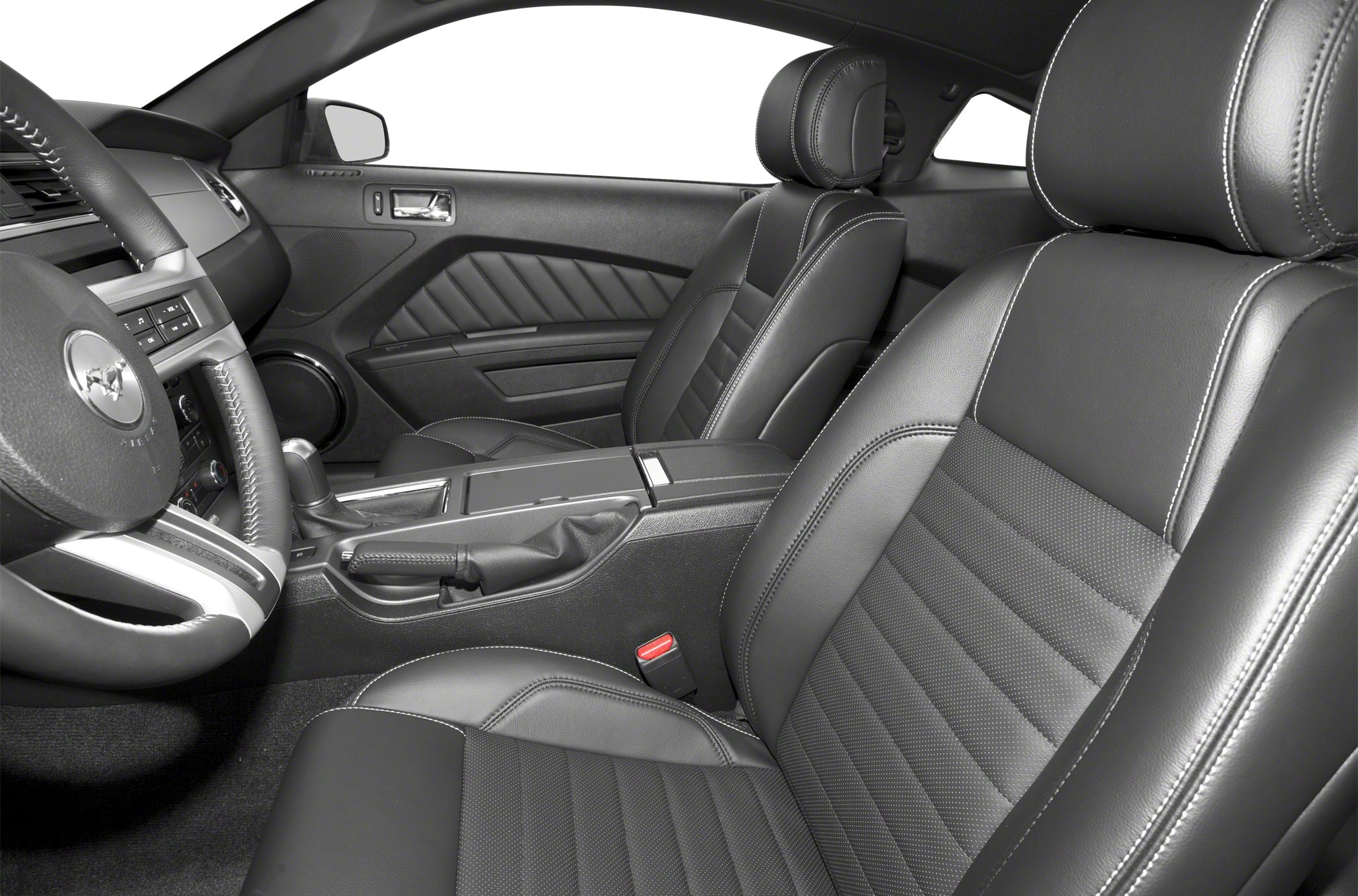 Black leather front seats with detailed stitching and a matching steering wheel