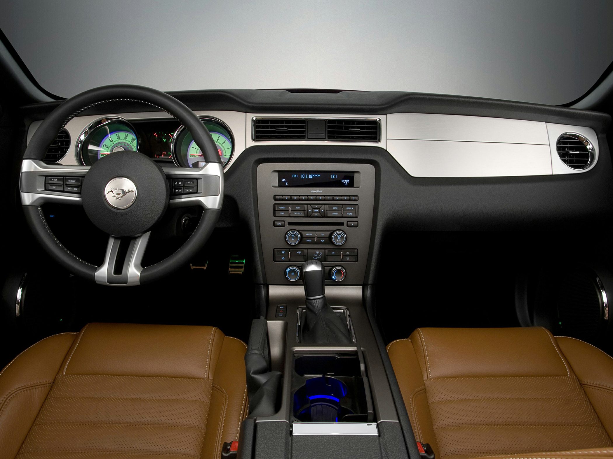 Dashboard with steering wheel and brown leather seats