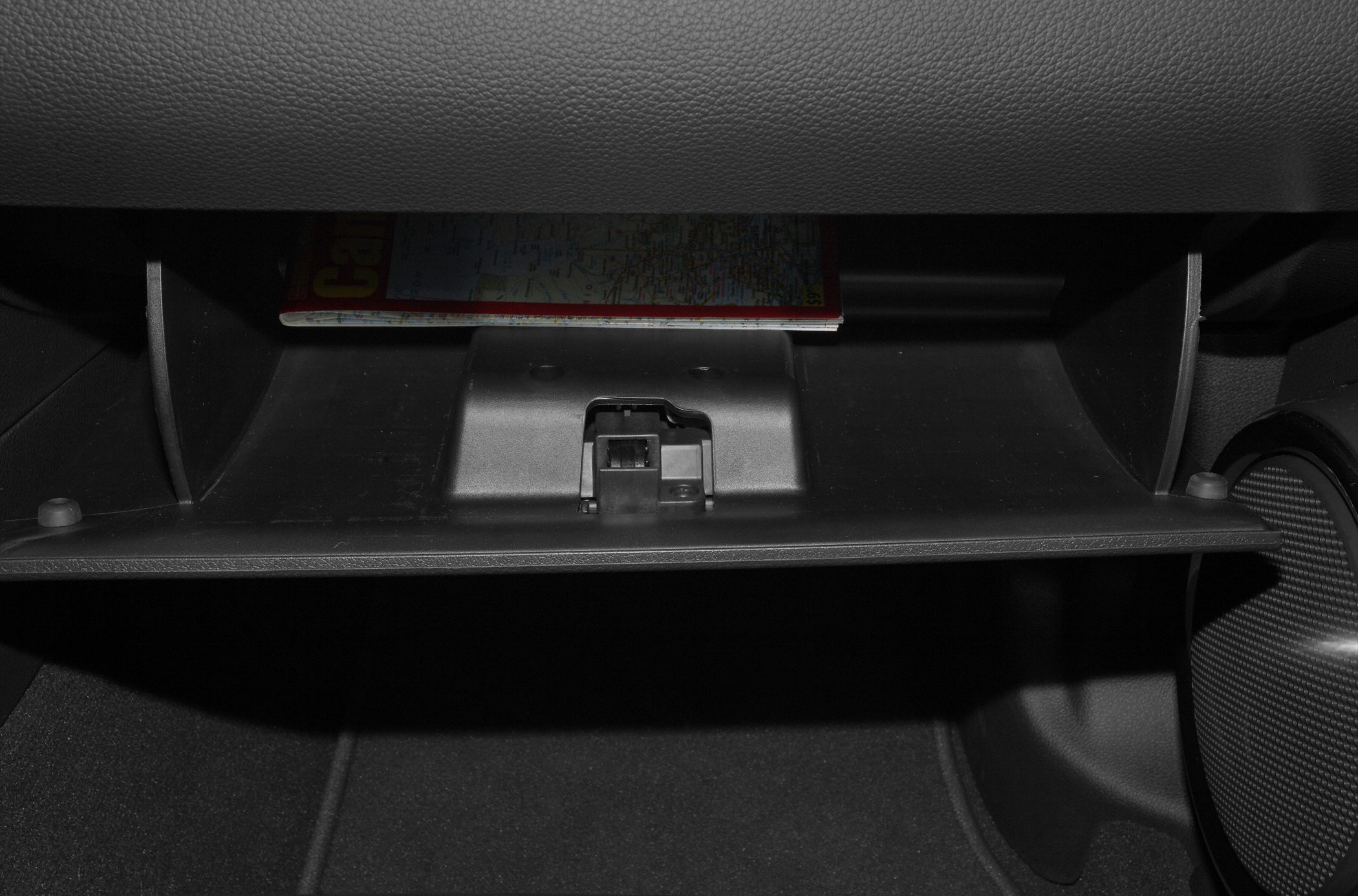 Open glove box compartment with storage space and latch