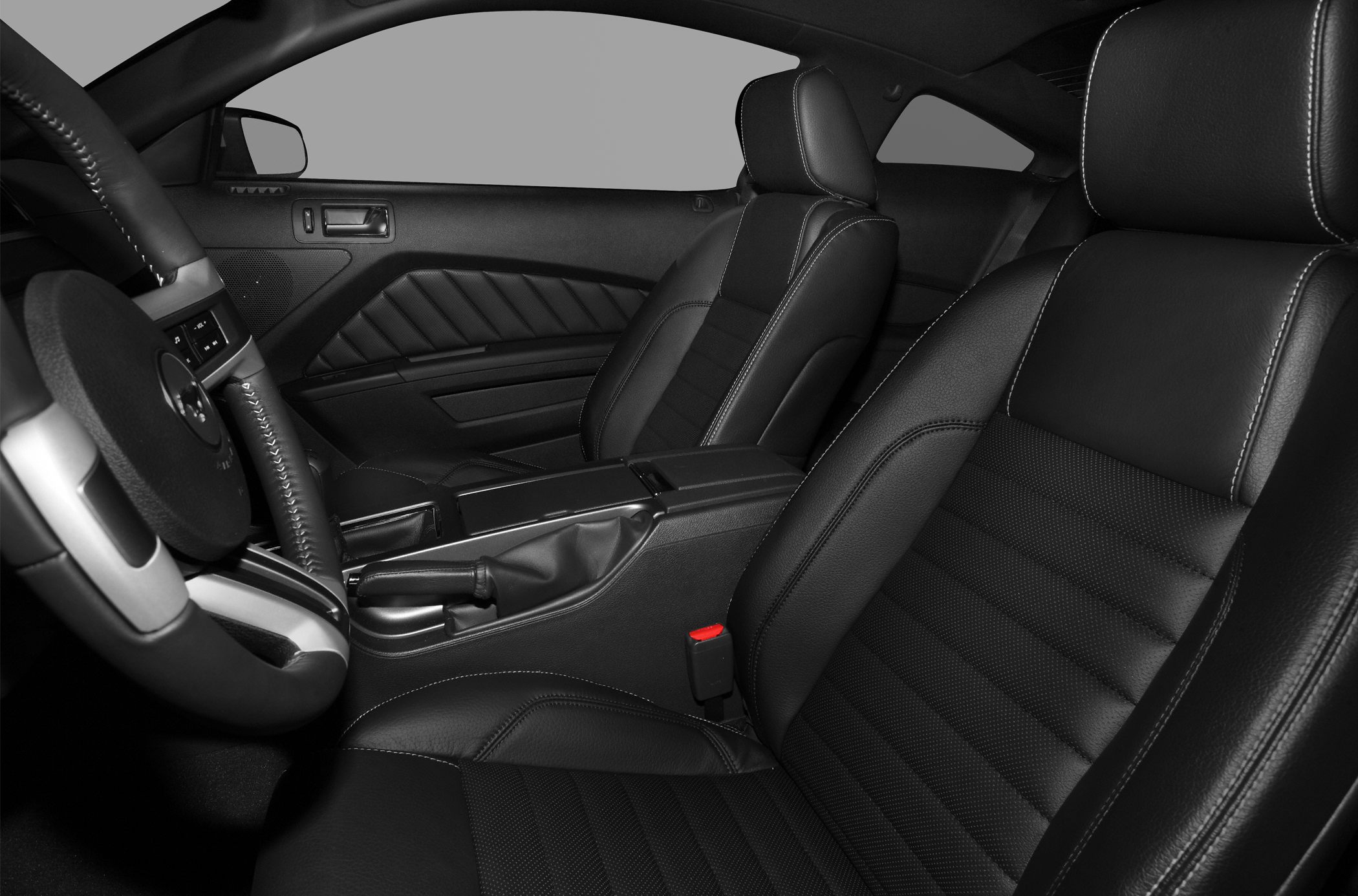 Leather sports seats and steering wheel in car interior
