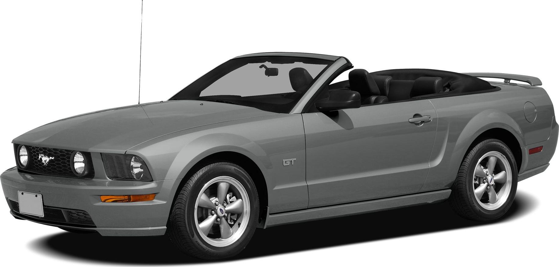 Front side view of a convertible Mustang with open roof and sporty wheels