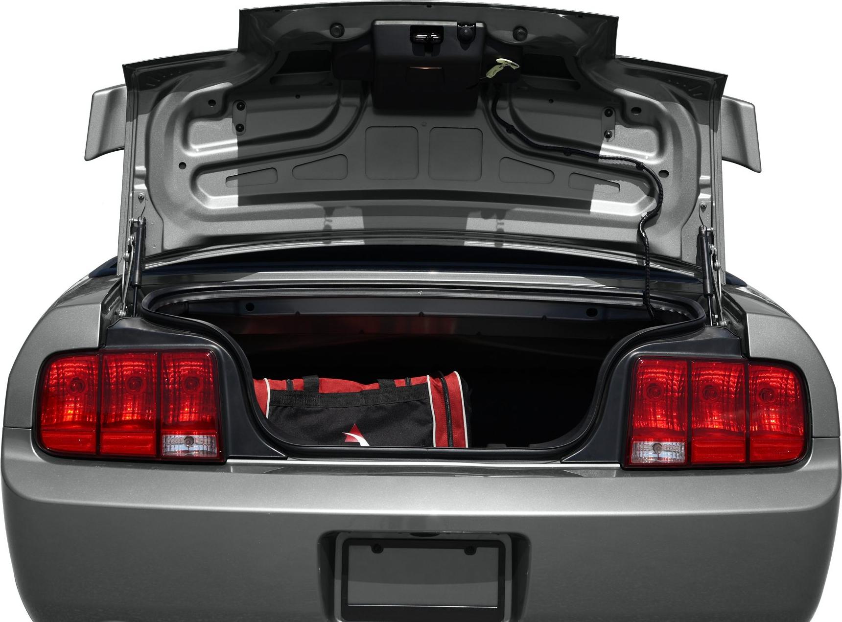 Open rear trunk with red tail lights and visible cargo space