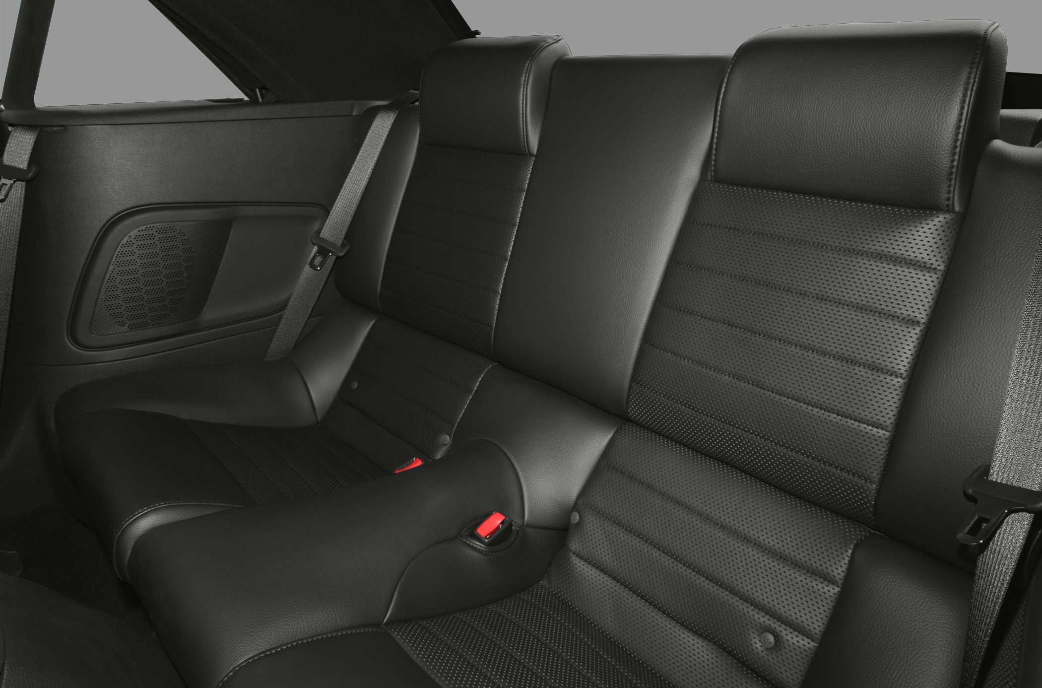Black leather rear seats with perforated sections and seat belts
