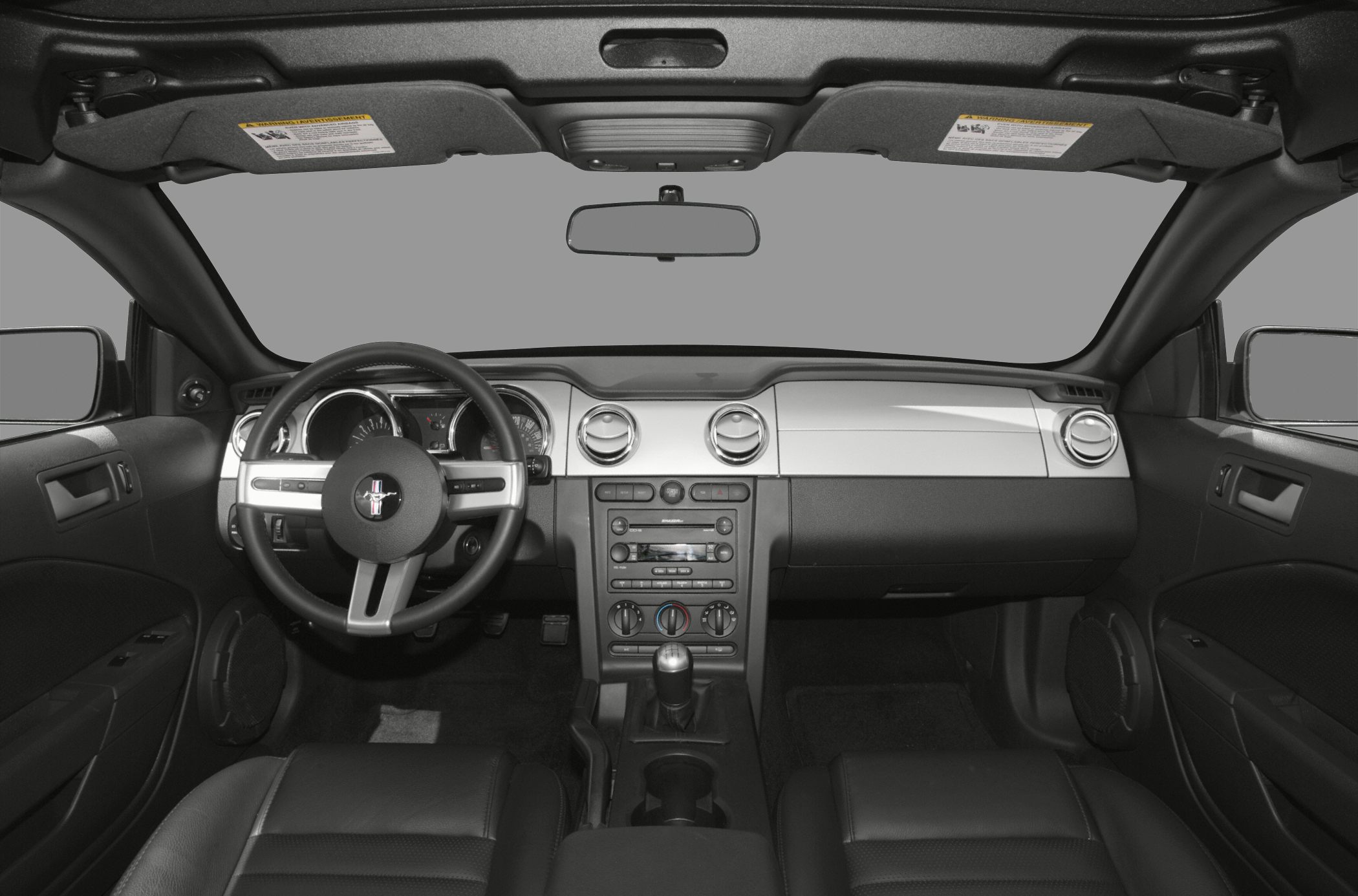 Dashboard, steering wheel, and center console of a convertible car interior