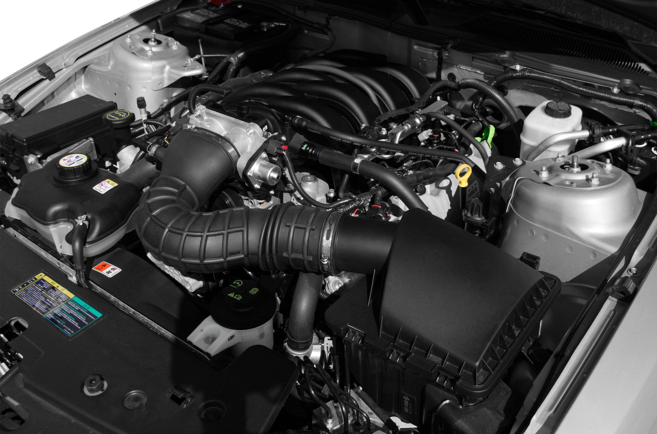 Close-up of engine bay with air intake and engine components