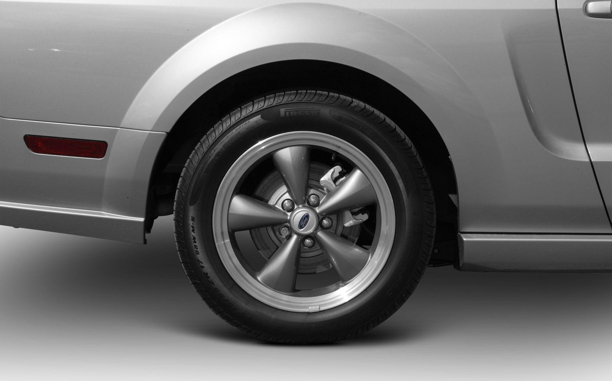 Five-spoke alloy wheel and tire with brake caliper and side marker