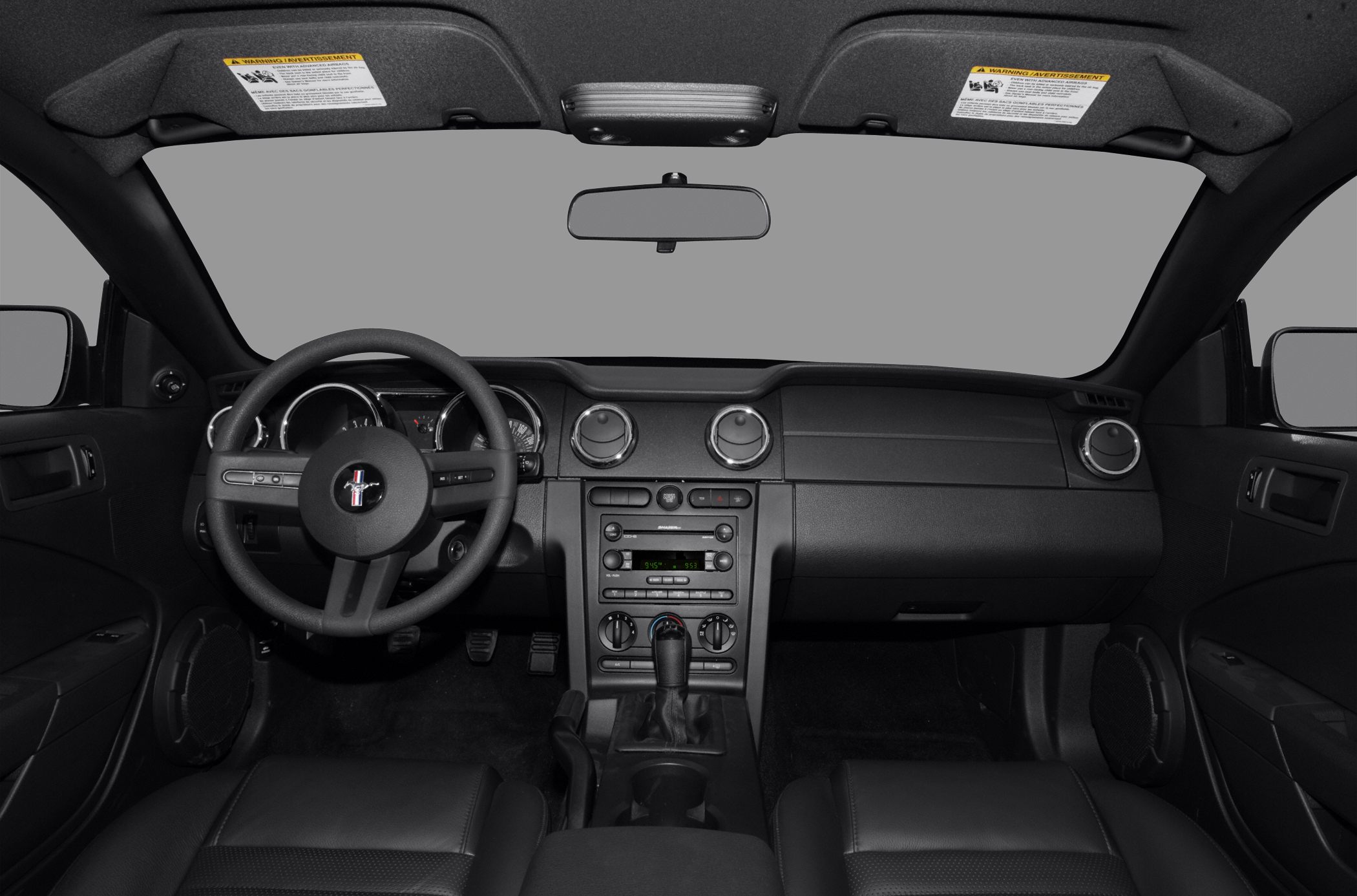 Dashboard and steering wheel with central controls and air vents