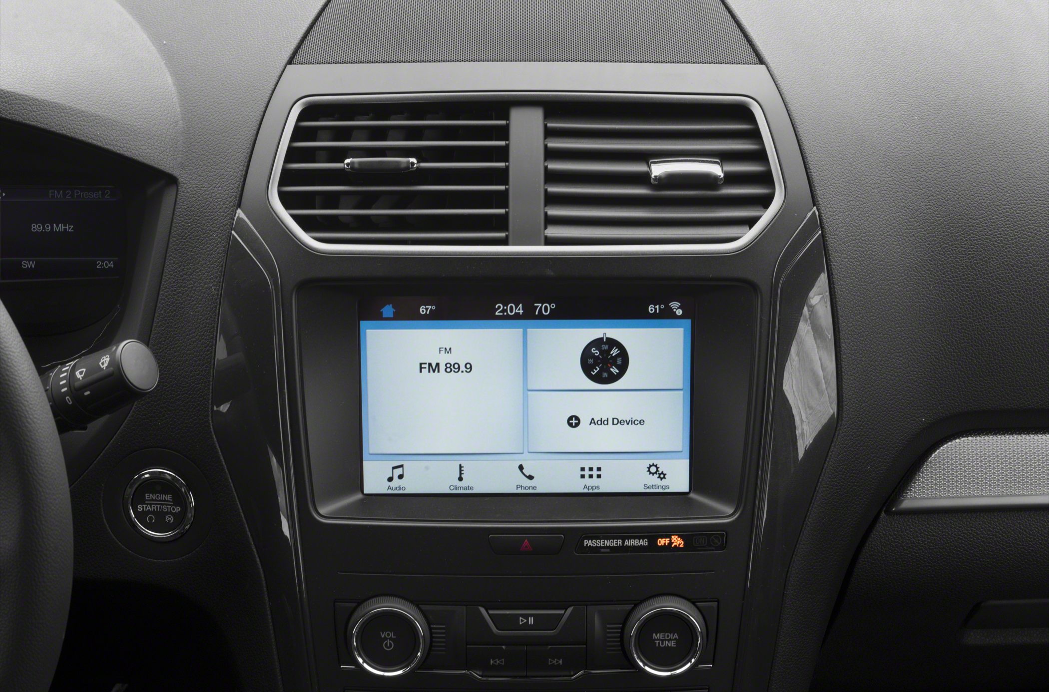 Touchscreen infotainment and dashboard controls with engine start button