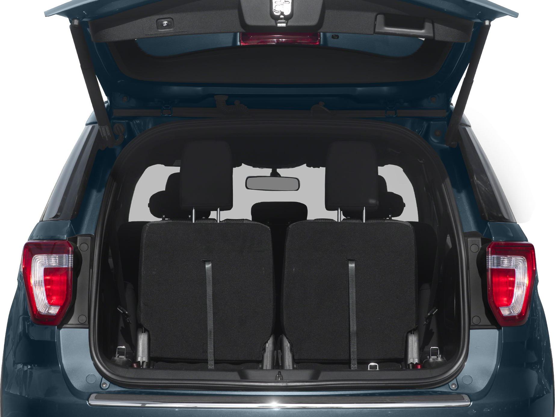 Open tailgate and folded rear seats in SUV