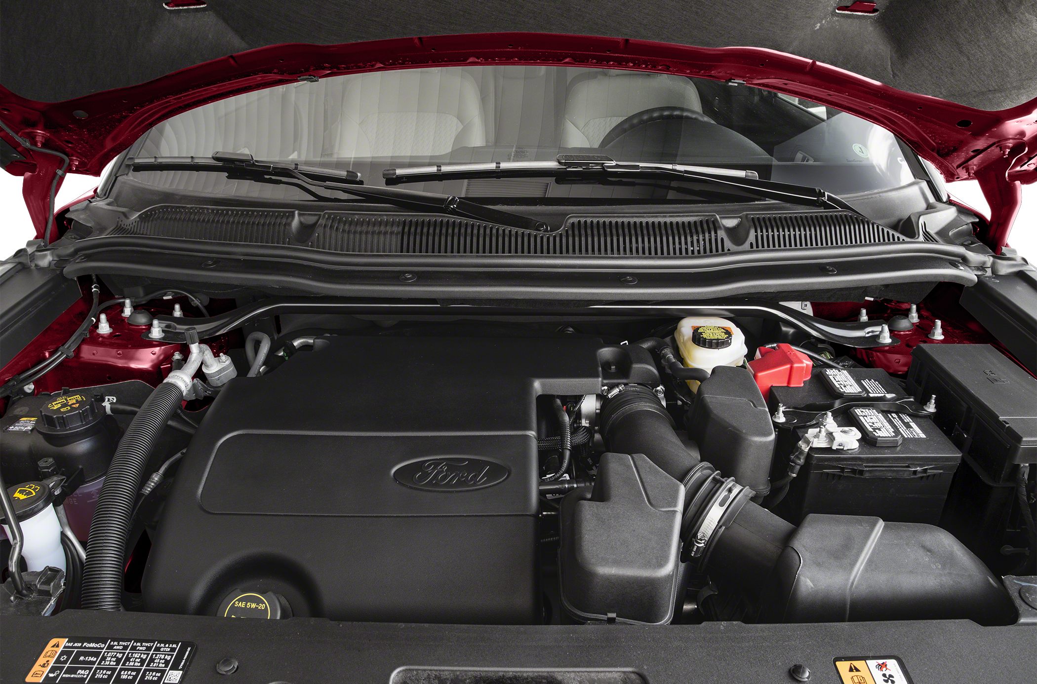 Engine bay with covered engine and battery components