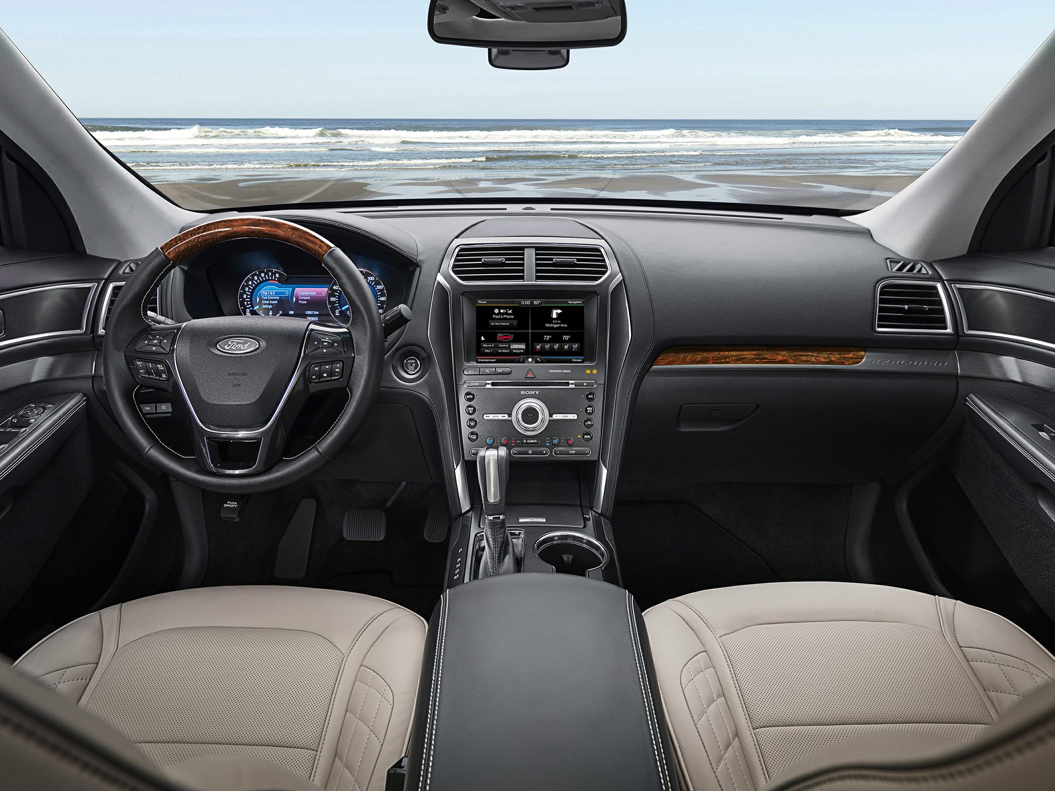 Dashboard and steering wheel with touchscreen and wood accent