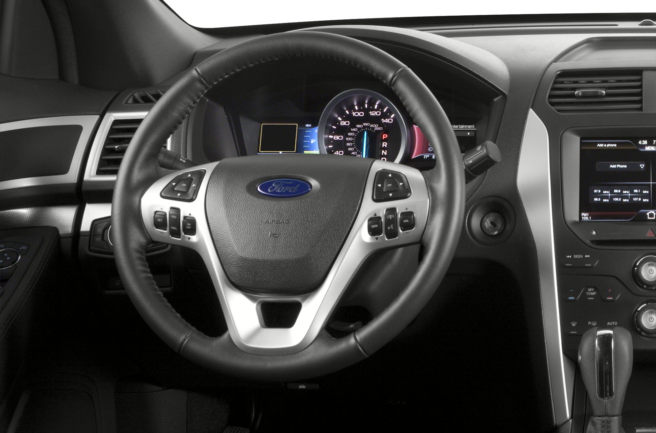 Multifunction leather steering wheel with dashboard instrument cluster and infotainment display.
