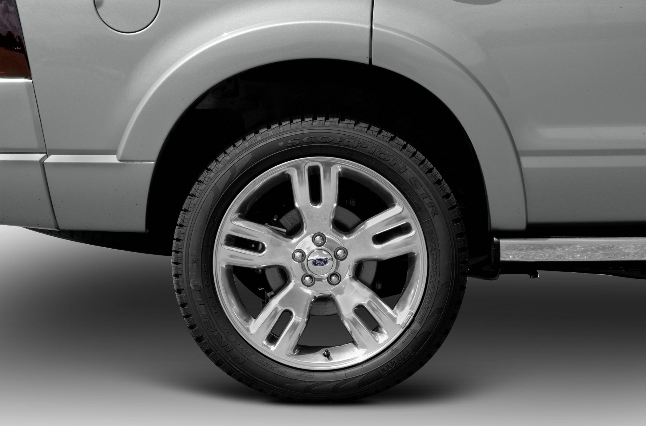 Alloy wheel and tire close-up on SUV rear wheel arch