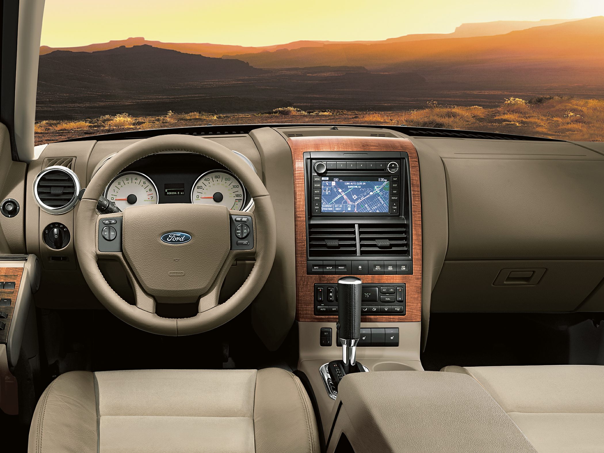 Leather steering wheel and wood trim console with navigation system