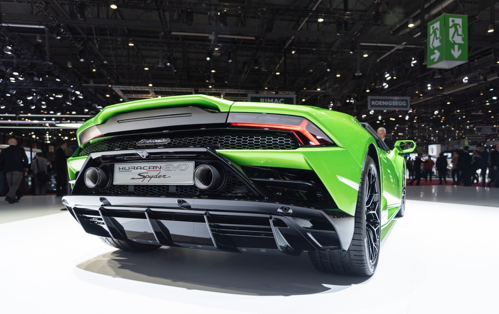 Green supercar rear with diffuser and distinctive taillights