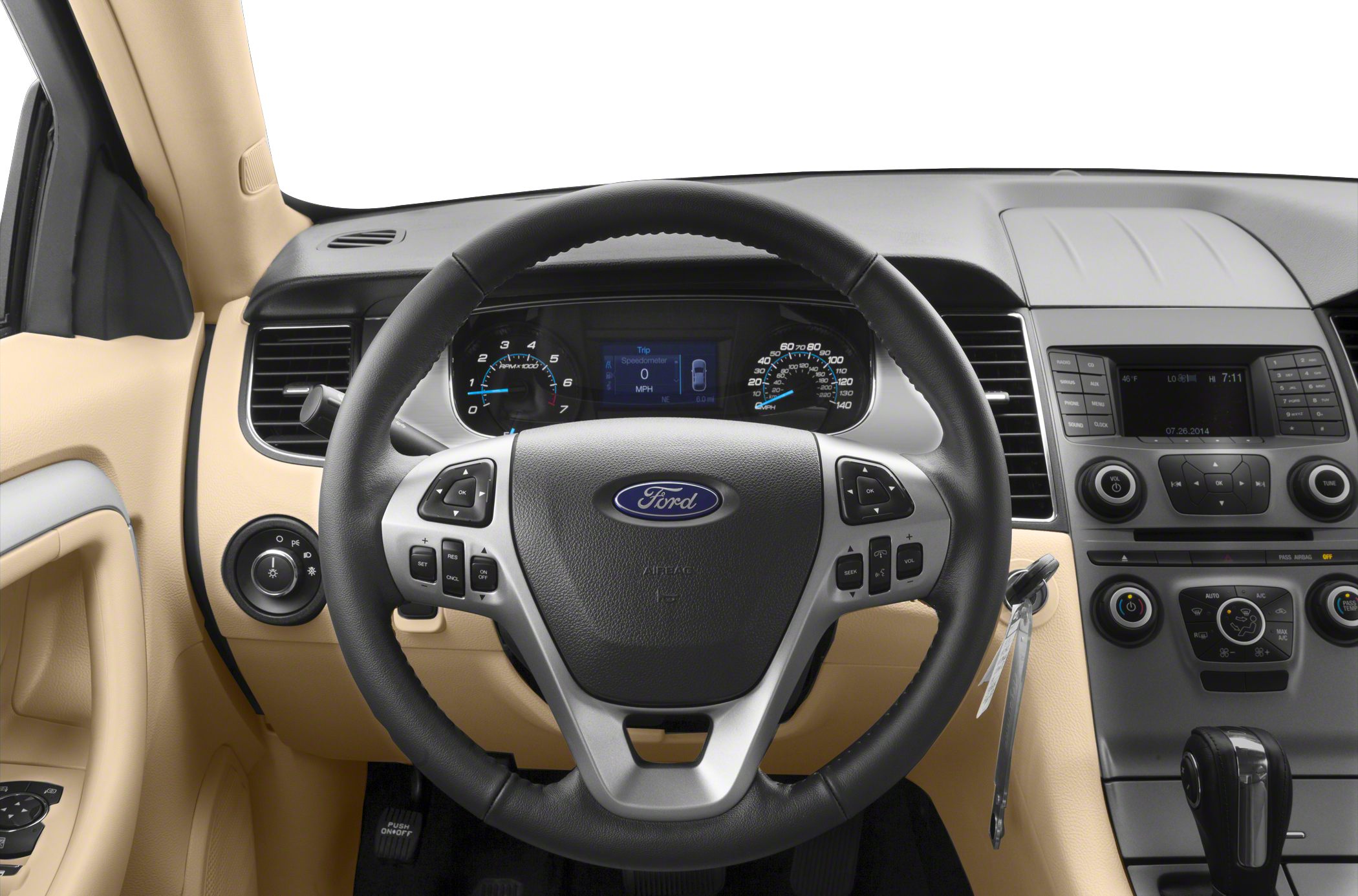 Steering wheel with controls, instrument cluster, and central dashboard display