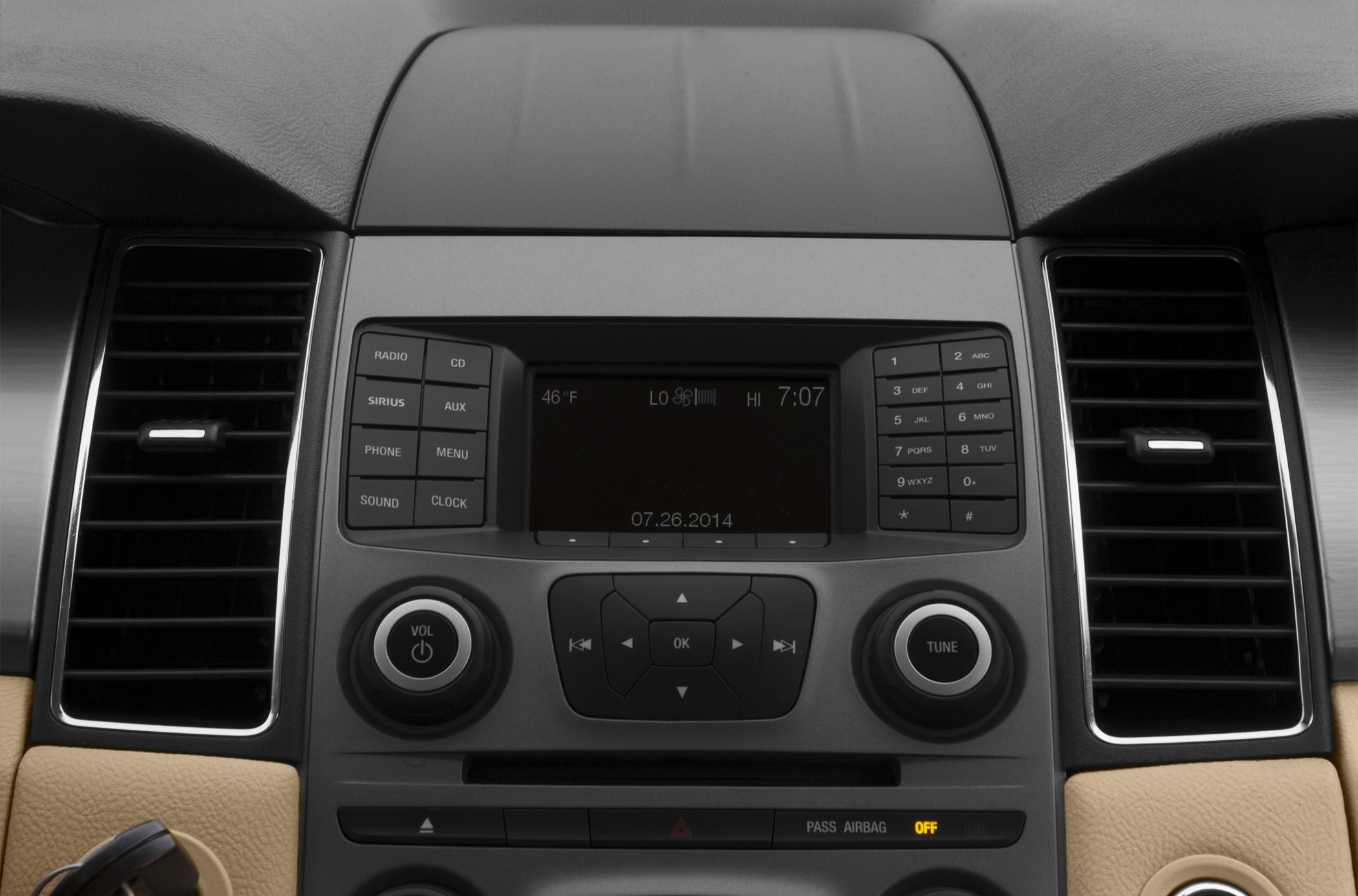 Car dashboard audio control panel with buttons and air vents
