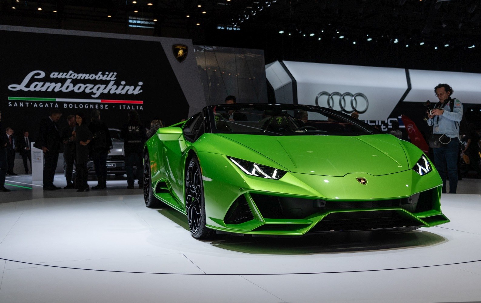 Aggressive front headlights and aerodynamic features of a convertible sports car