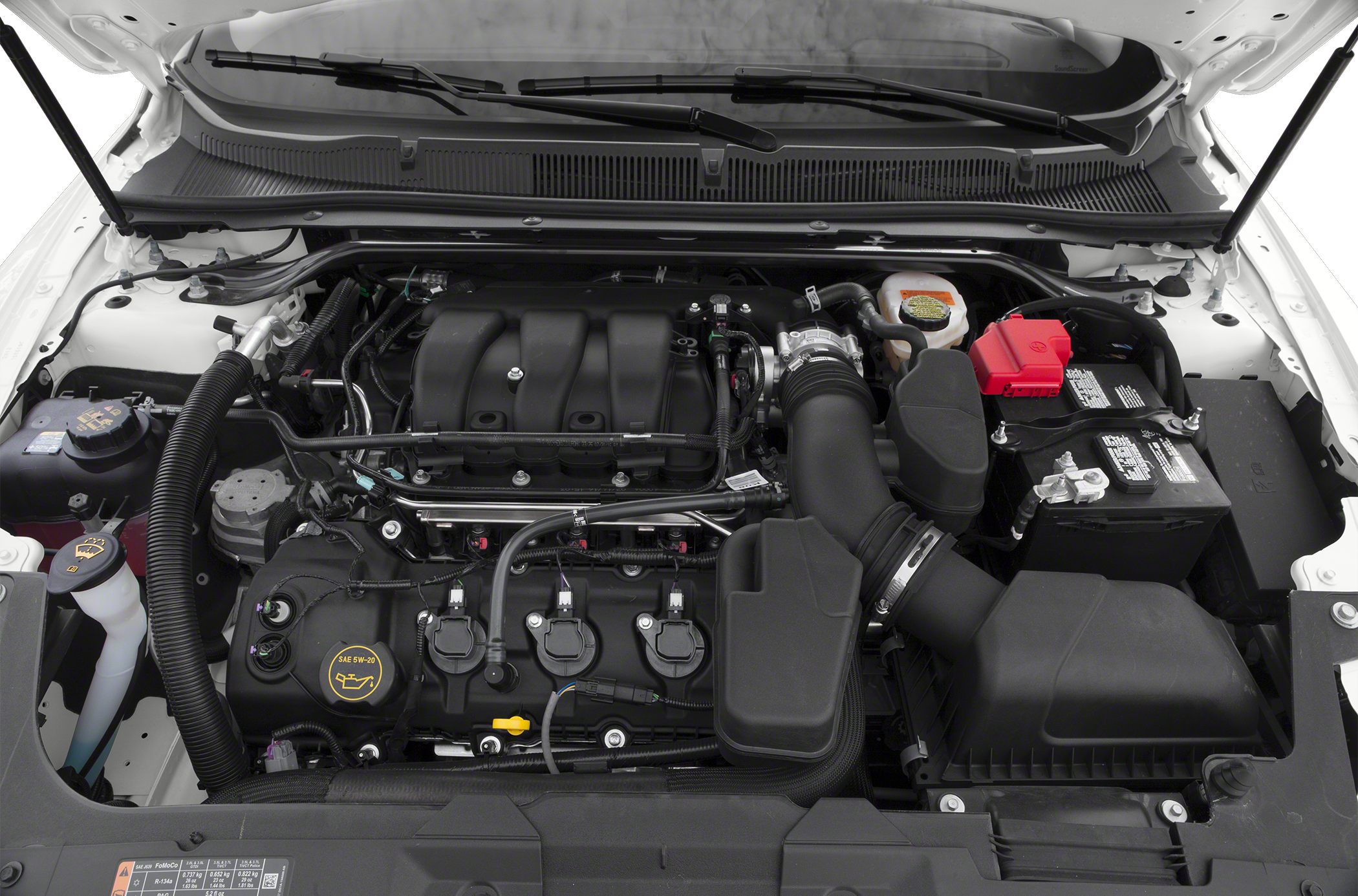 Clean engine bay with visible intake system and car battery