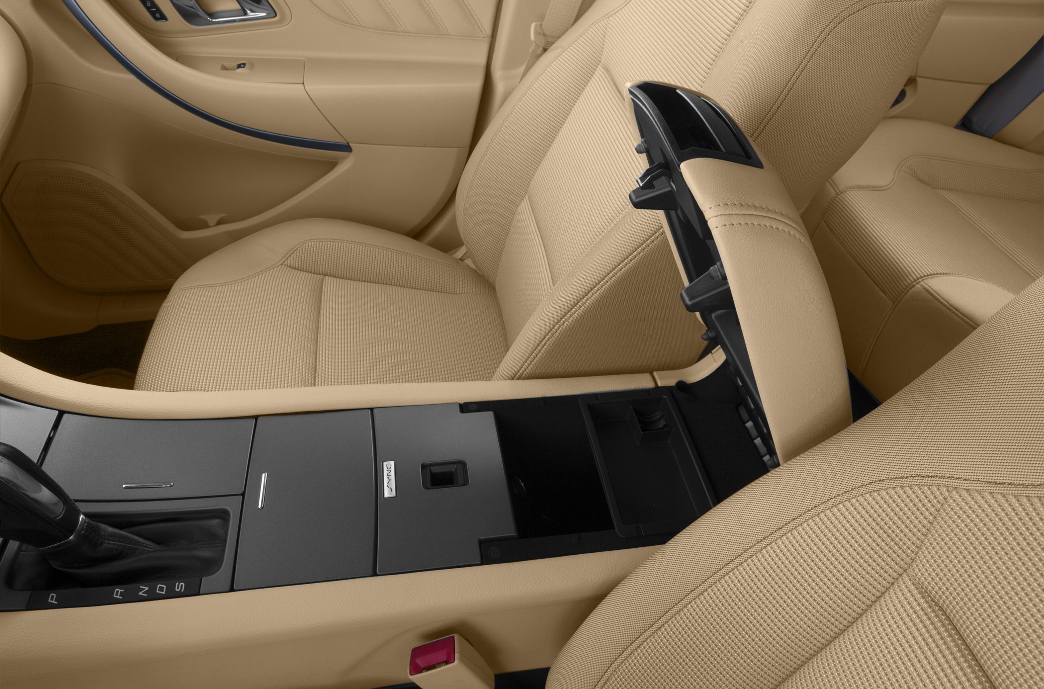 Beige car seats with an open center console in a beige interior