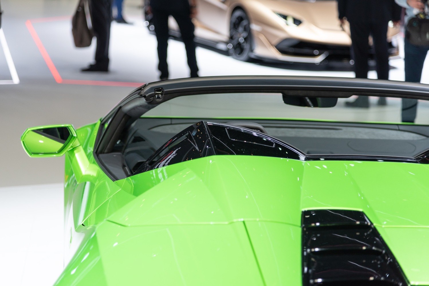Convertible rear design with side mirror detail in vibrant green